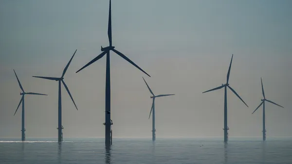 The sun rises over the EDF energy offshore windfarm on July 19, 2024 in Redcar, England.