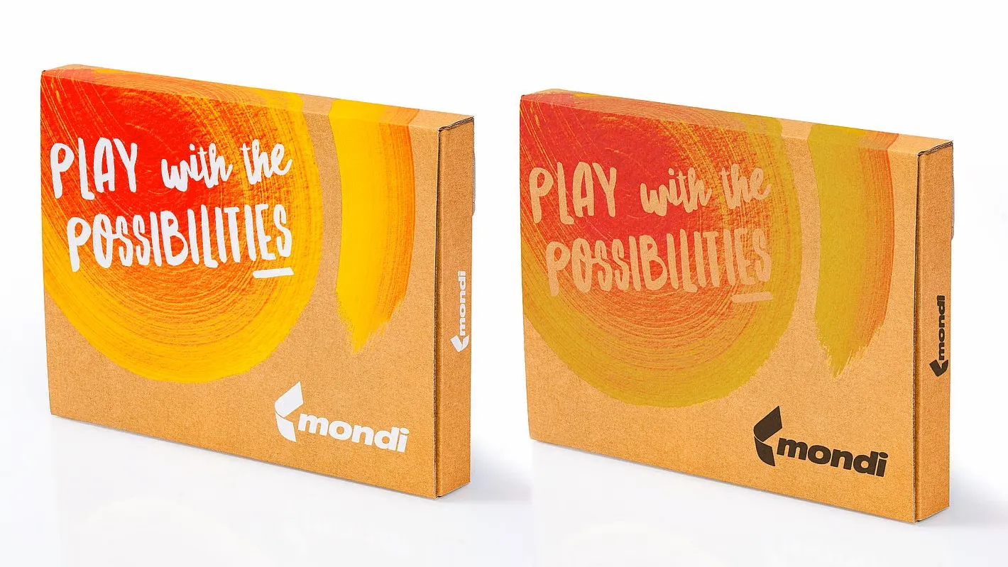 Two boxes next to each other with nearly identical yellow and orange printing, and one has white Mondi branding.