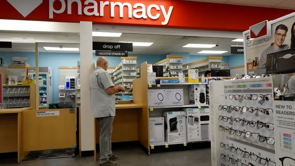 A customer waits at a CVS pharmacy.