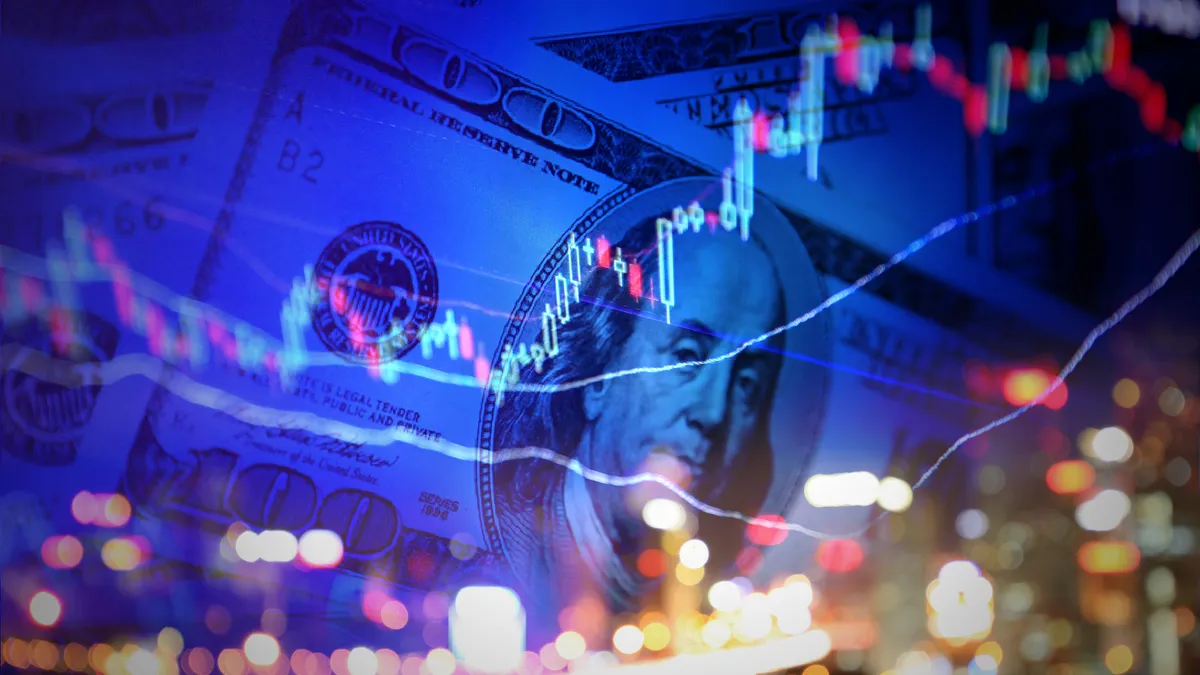 A candlestick stock chart is seen out of focus against a background of $100 dollar bills in this composite stock image.