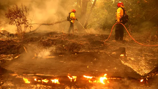 firefighters extinguish spot fires