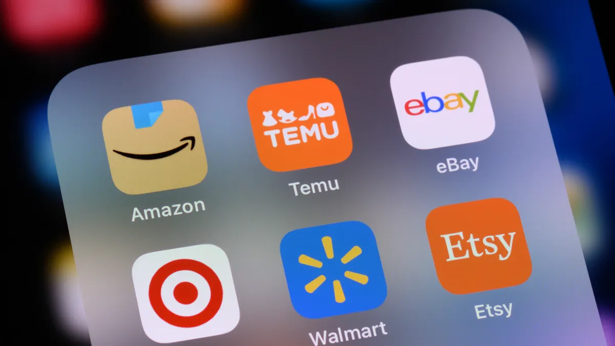 An image of a phone with apps including Etsy, Temu and Amazon.