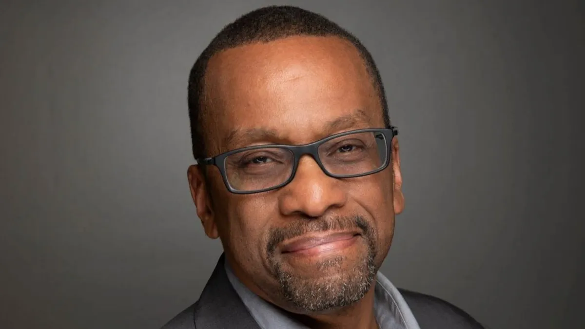 Horace Dawson, CEO of Red Lobster, wearing a dark gray suit