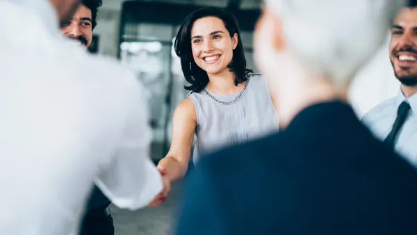 Business people shaking hands.