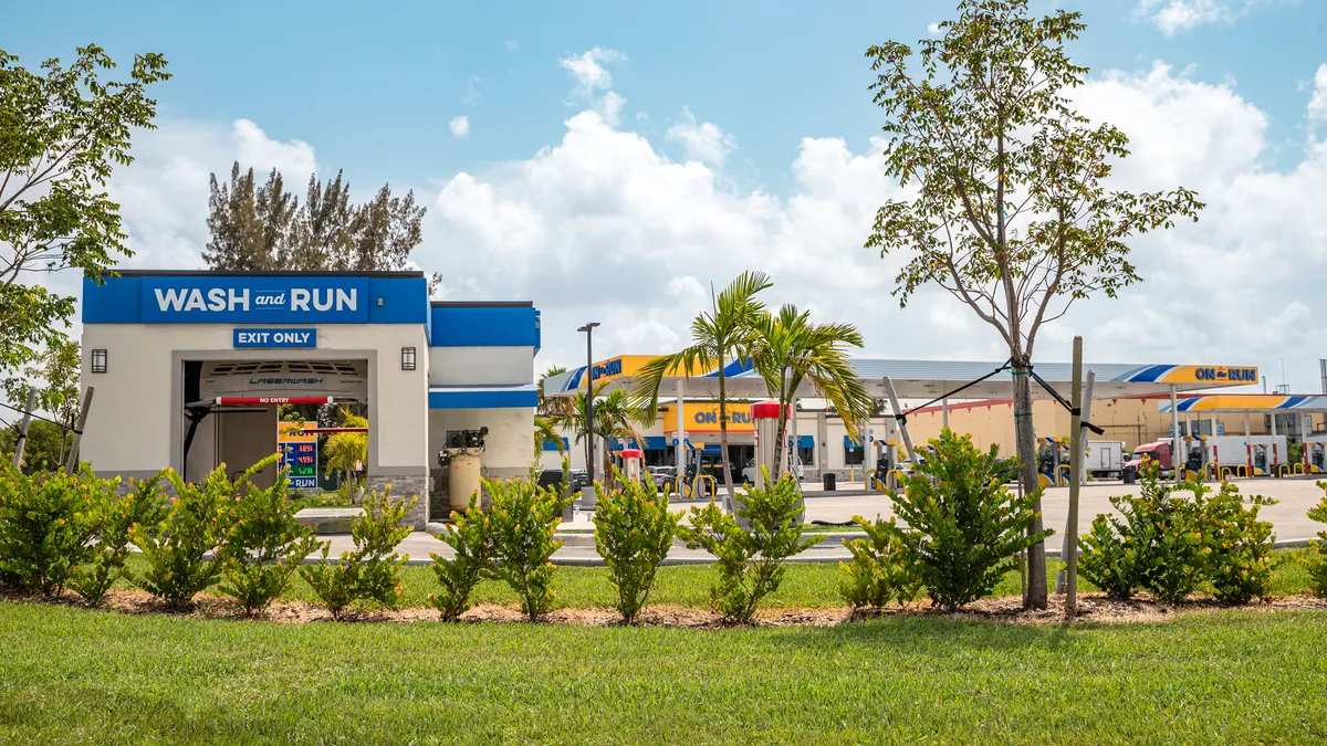 A photo of a Wash and Run car wash at an On the Go convenience store.