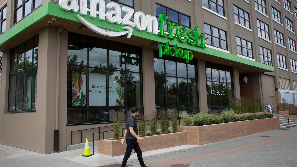 A man walks past an AmazonFresh Pickup location on June 16, 2017 in Seattle, Washington