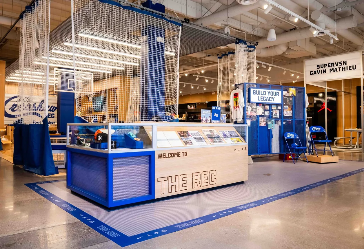 The inside of The Crenshaw Rec by Foot Locker, featuring a basketball hoop