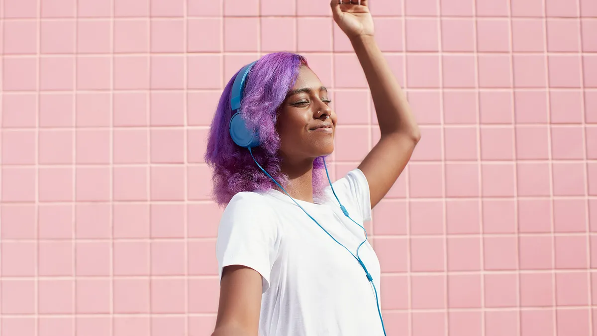 Spotify photo of person dancing to music in headphones