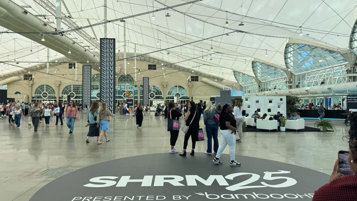 SHRM25 attendees walk through the conference center.