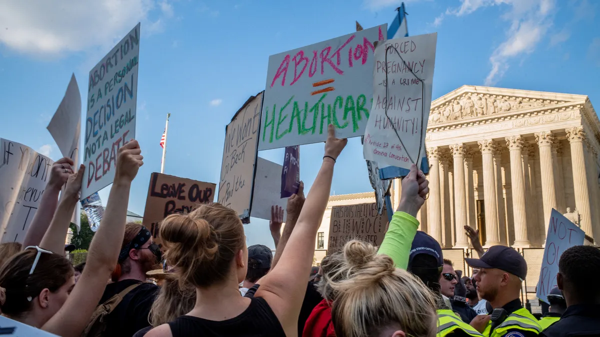 Abortion-rights demonstrators protest in front of the Supreme Court building following the announcement to the Dobbs v Jackson Women's Health Organization ruling on June 25, 2022 in Washington, DC.