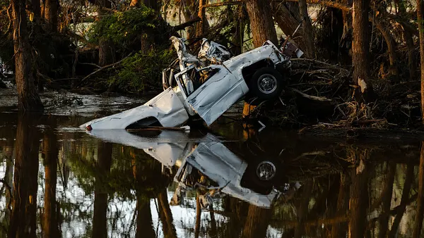 A pickup truck severely crushed in the wake of catastrophic flooding in Texas.