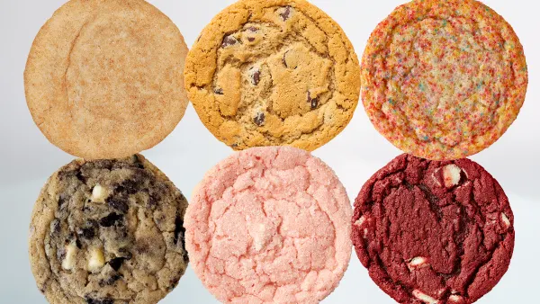 An image of six cookies of different colors and flavors in front of a white background.