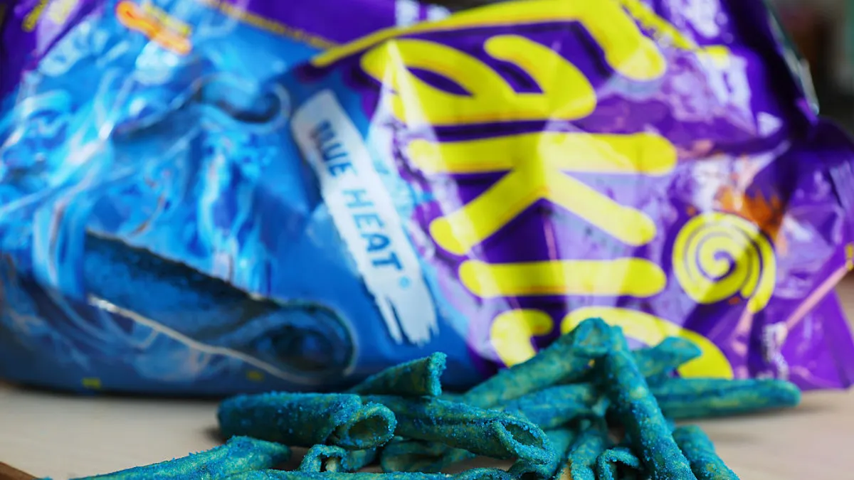 A Takis Blue Heat bag is seen on a table