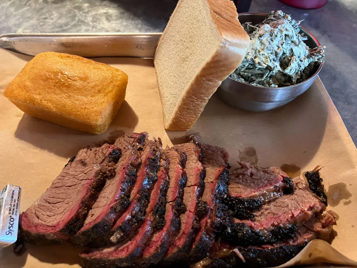 The brisket, cornbread and serrano cheese spinach at Stubb's Bar-B-Q in Austin, Texas.