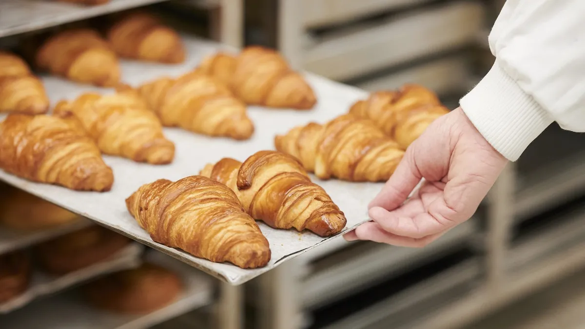 Croissant manufacturing inside facility of France-based baked goods company Bridor.