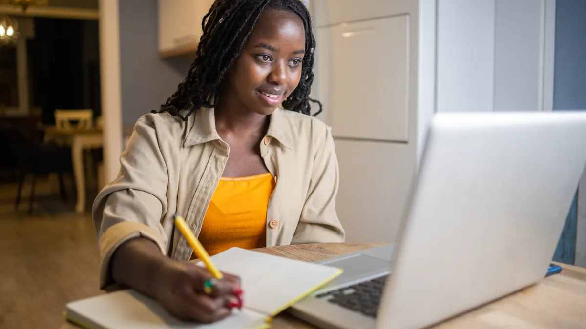 Young woman working from home.