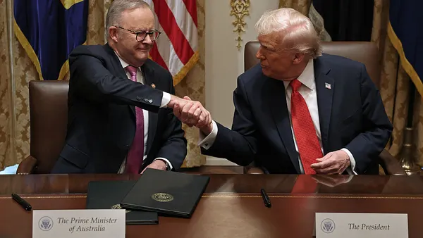 Prime Minister of Australia Anthony Albanese and U.S. President Donald Trump shake hands in the White House Cabinet Room.