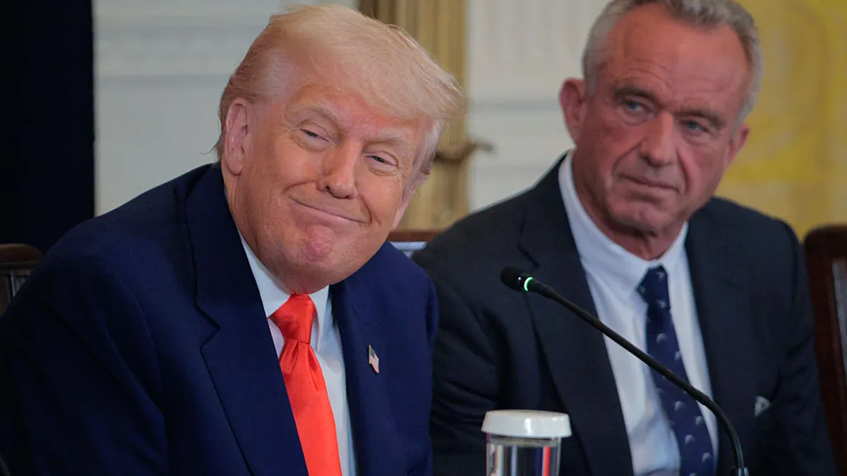 president trump smiling with robert kennedy jr.