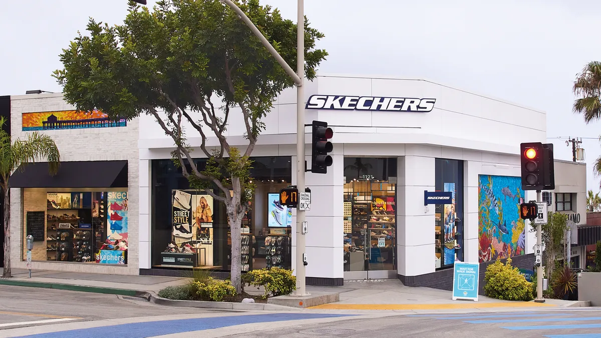 A Skechers storefront is pictured on a street corner.