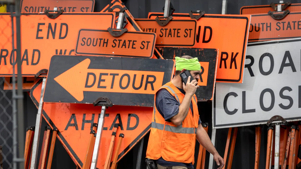 A construction worker walks through the Stamford Transportation Center on August 28, 2023 in Stamford, Connecticut