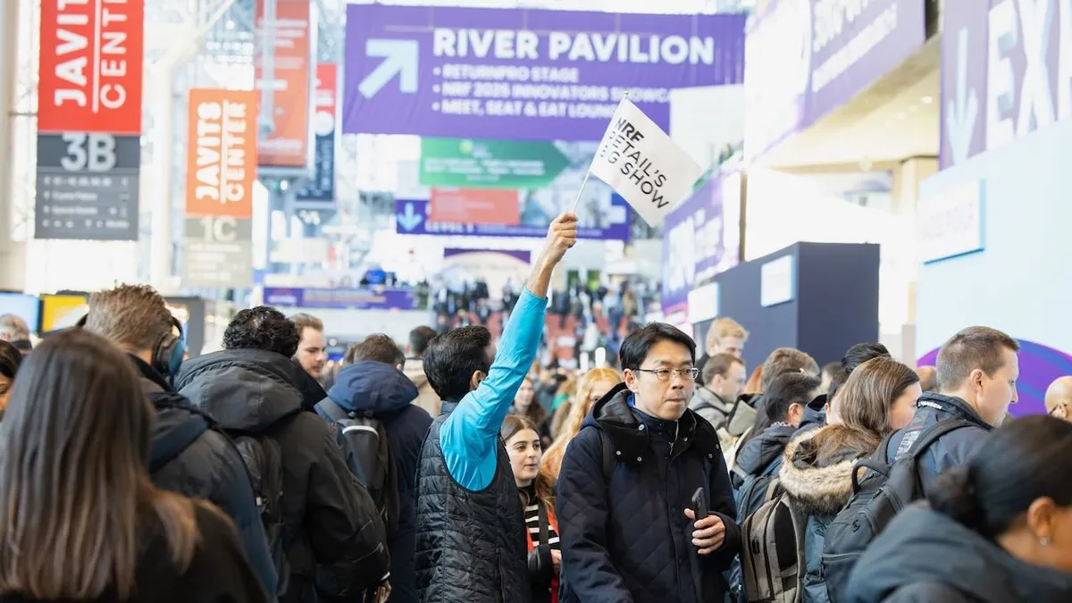 A crowd of people at a conference.