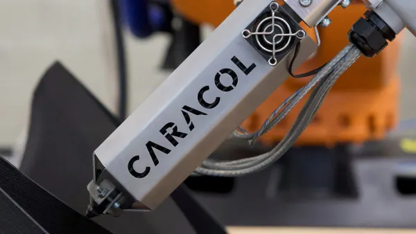 Caracol's additive manufacturing robot automates component fabrication.