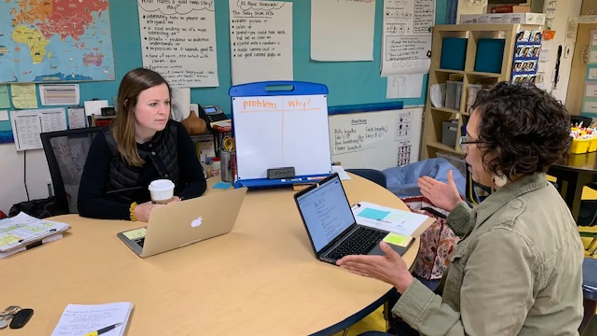 High Tech Explorer 4th grade teacher Meg Hassey, left, meets with first-year apprentice Melina Aquirre.