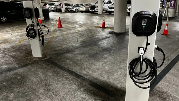 Electric vehicle charging stations in a parking garage.