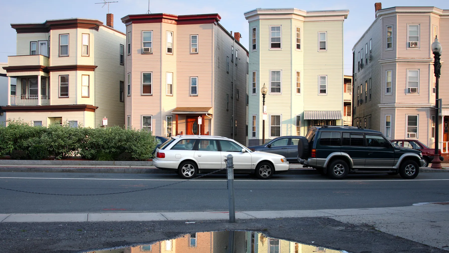 Street view of several three-story housing buildings