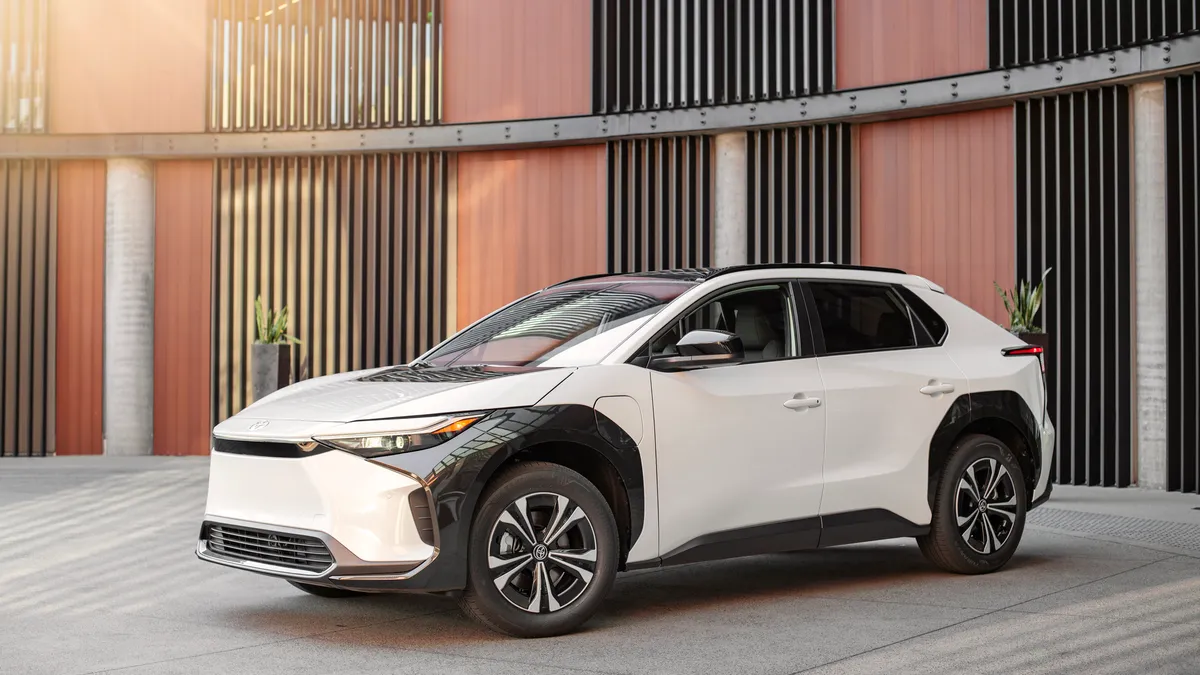 The Toyota bZ4X electric SUV parked in a driveway.