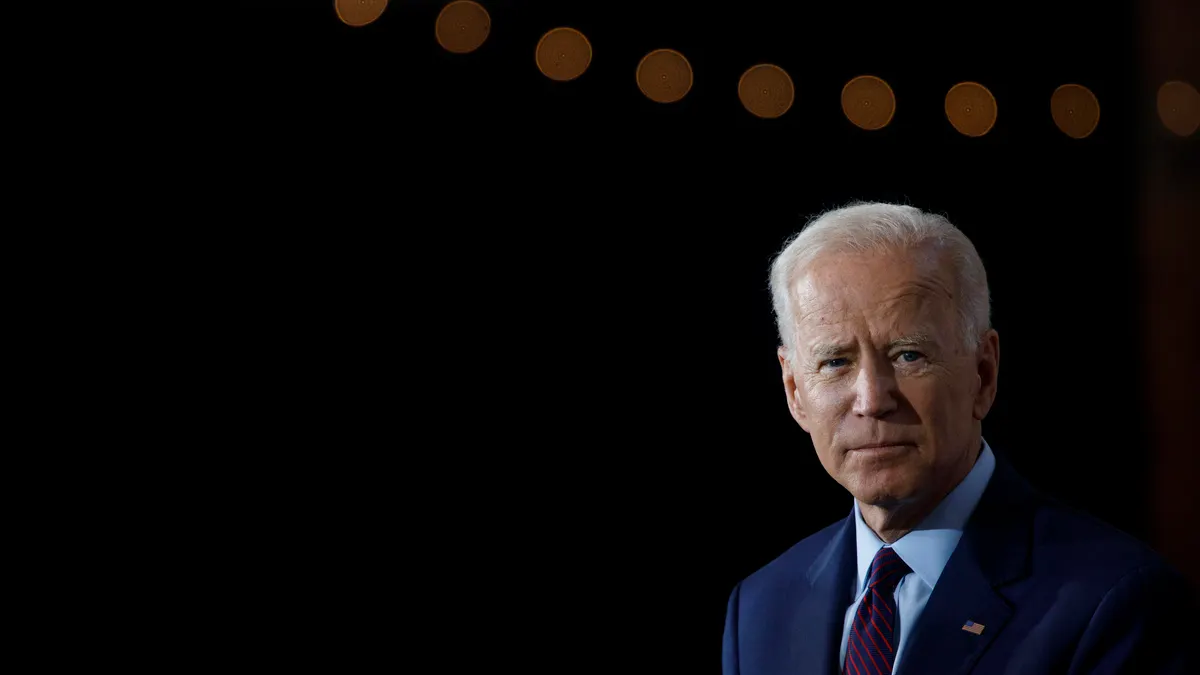 An image of Joe Biden delivering an address.