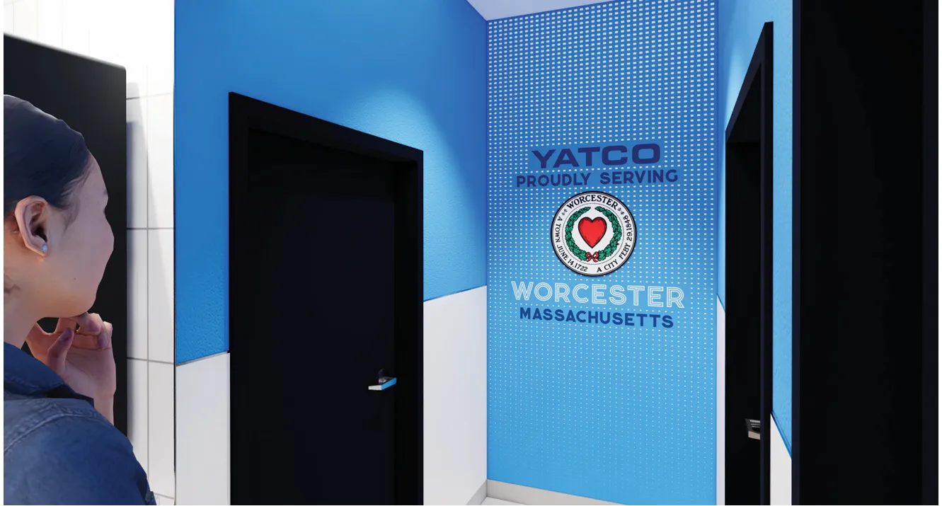 A rendering of the interior of a convenience store, showing a person standing in a hall looking at several closed doors. Lettering on the wall says &quot;Yatco. Proudly serving Worcester Massachusetts.&quot;.