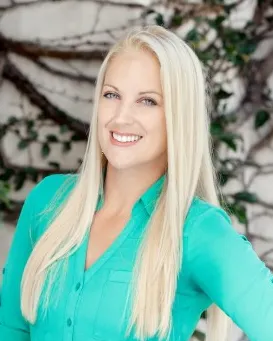 Headshot of a woman in business attire.