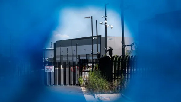 a large building seen through a hole