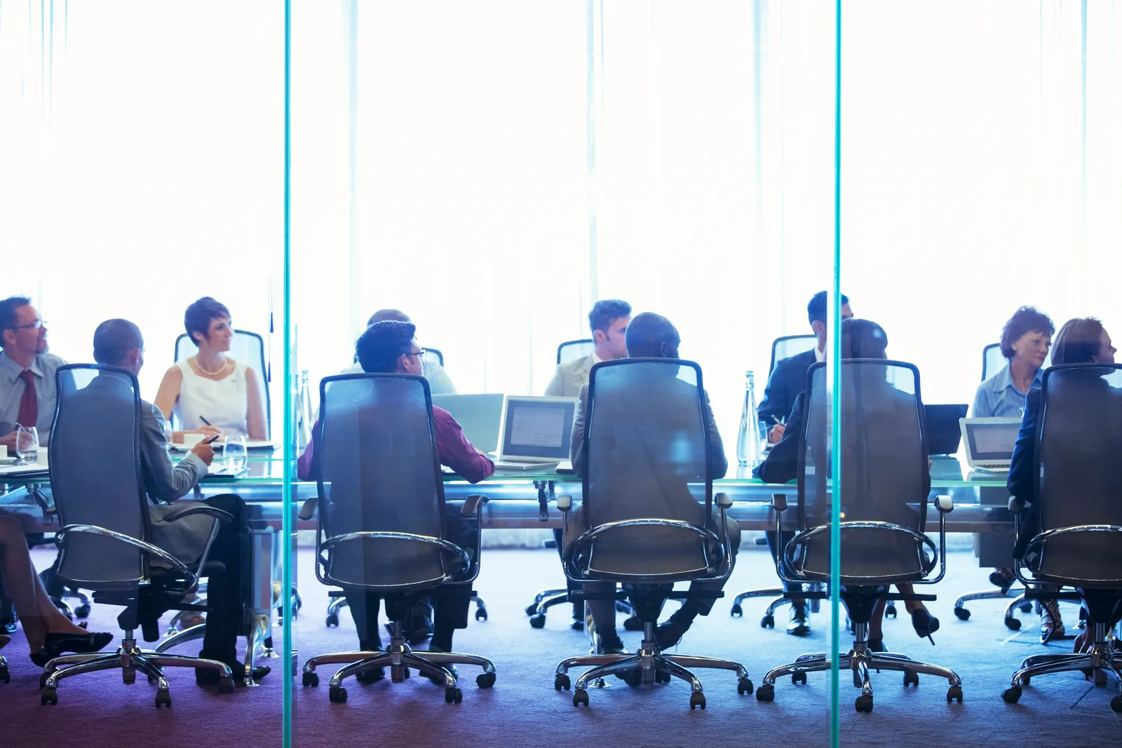 People sitting around a board room table