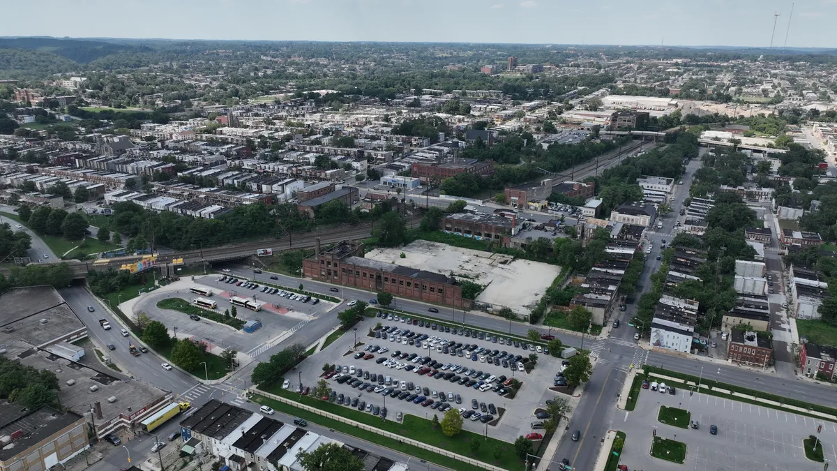 Aerial view of a cityscape with roads, parking lots and buildings where Amtrak's Frederick Douglass tunnel will be built.