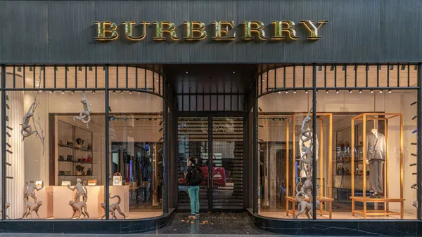 A woman looking inside a closed Burberry store on April 05, 2020 in Melbourne, Australia.