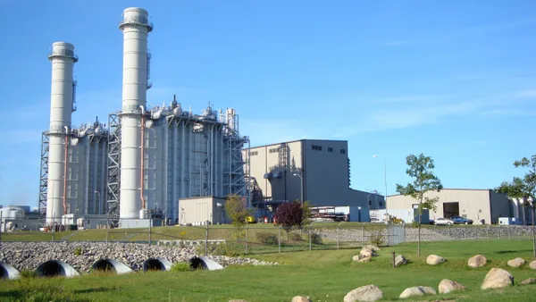 A power plant with two smoke stacks.