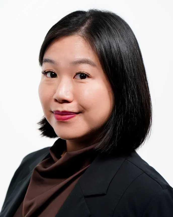 Headshot of a woman in business attire.