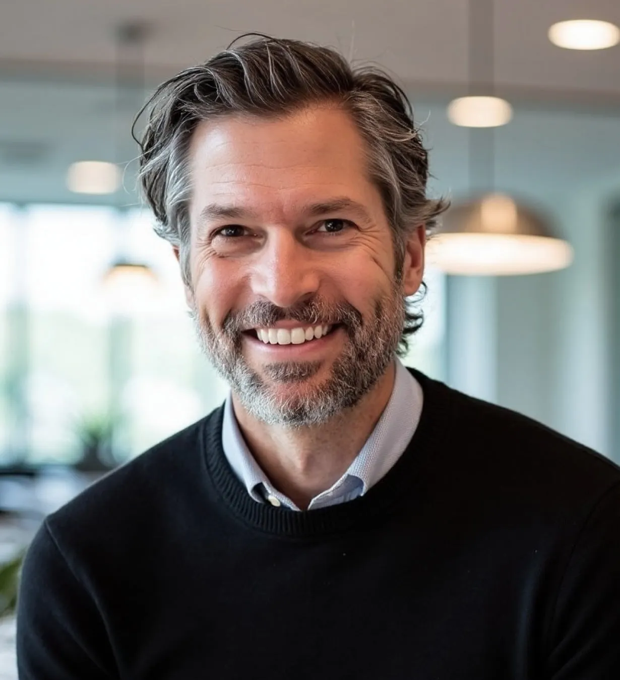 A headshot of Tassos Gianakakos, Kardigan's CEO.