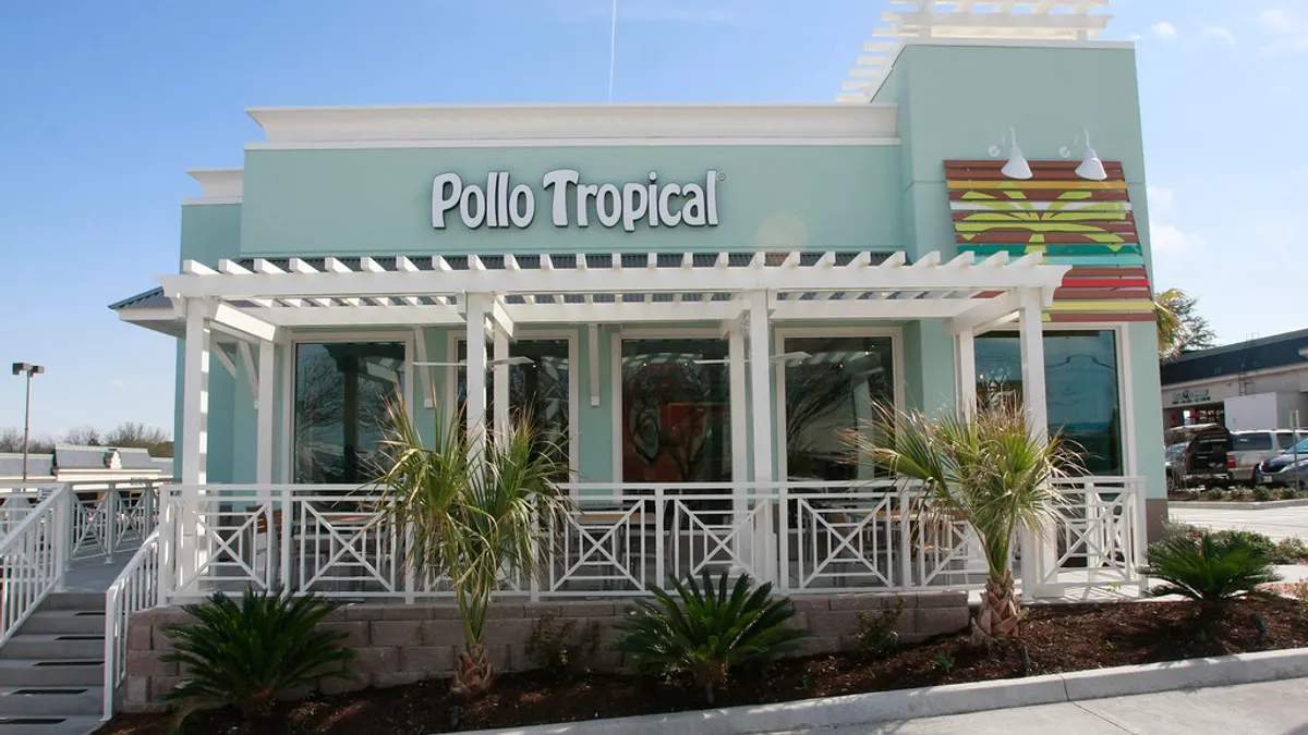 An image of a sky blue Pollo Tropical restaurant