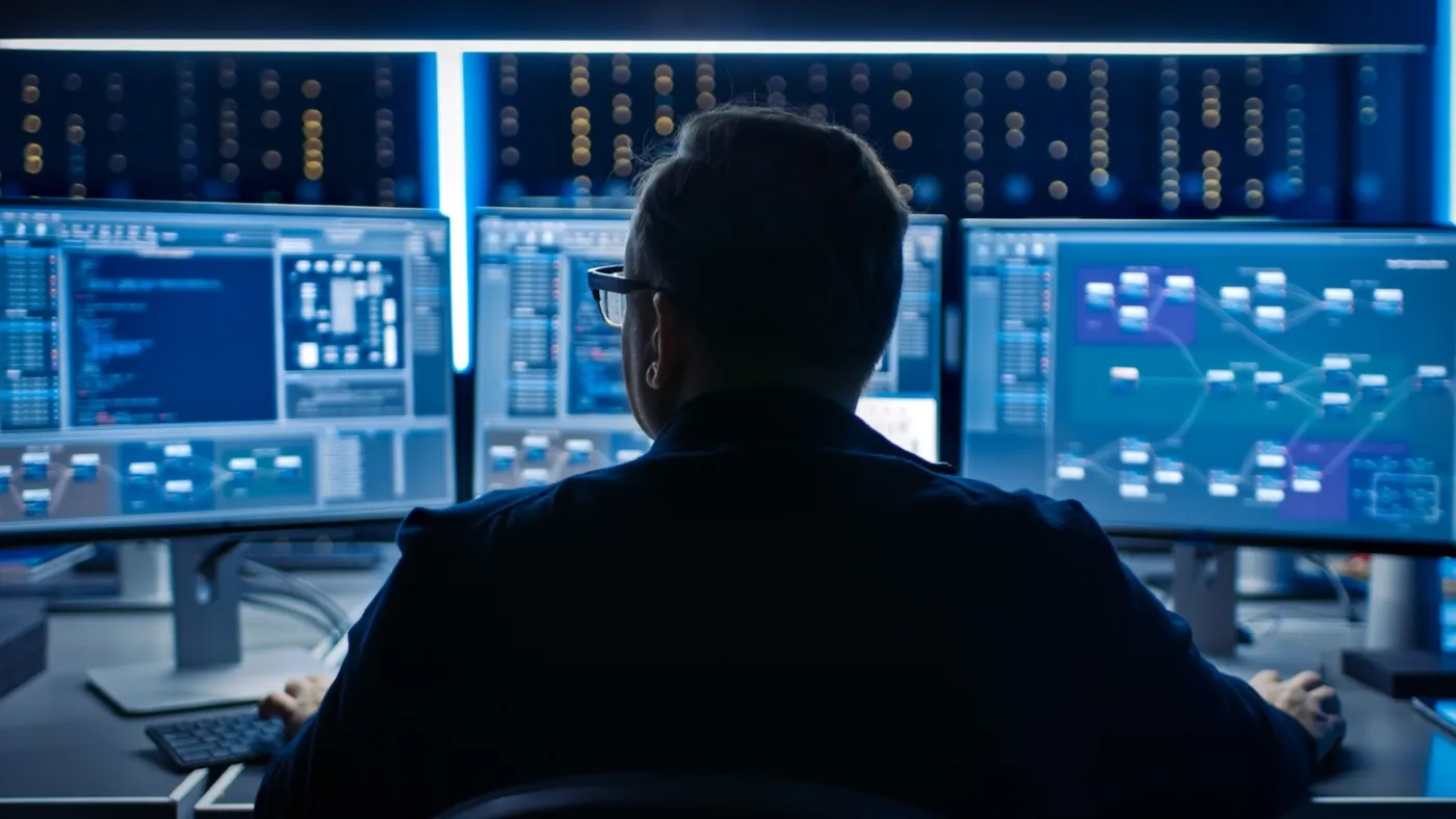 Professional IT Programer Working in Data Center on Desktop Computer.