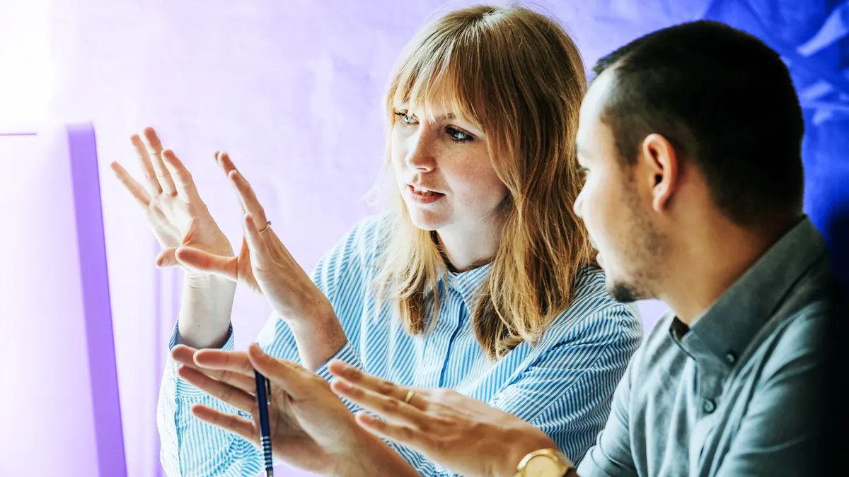 Two people discussing at work