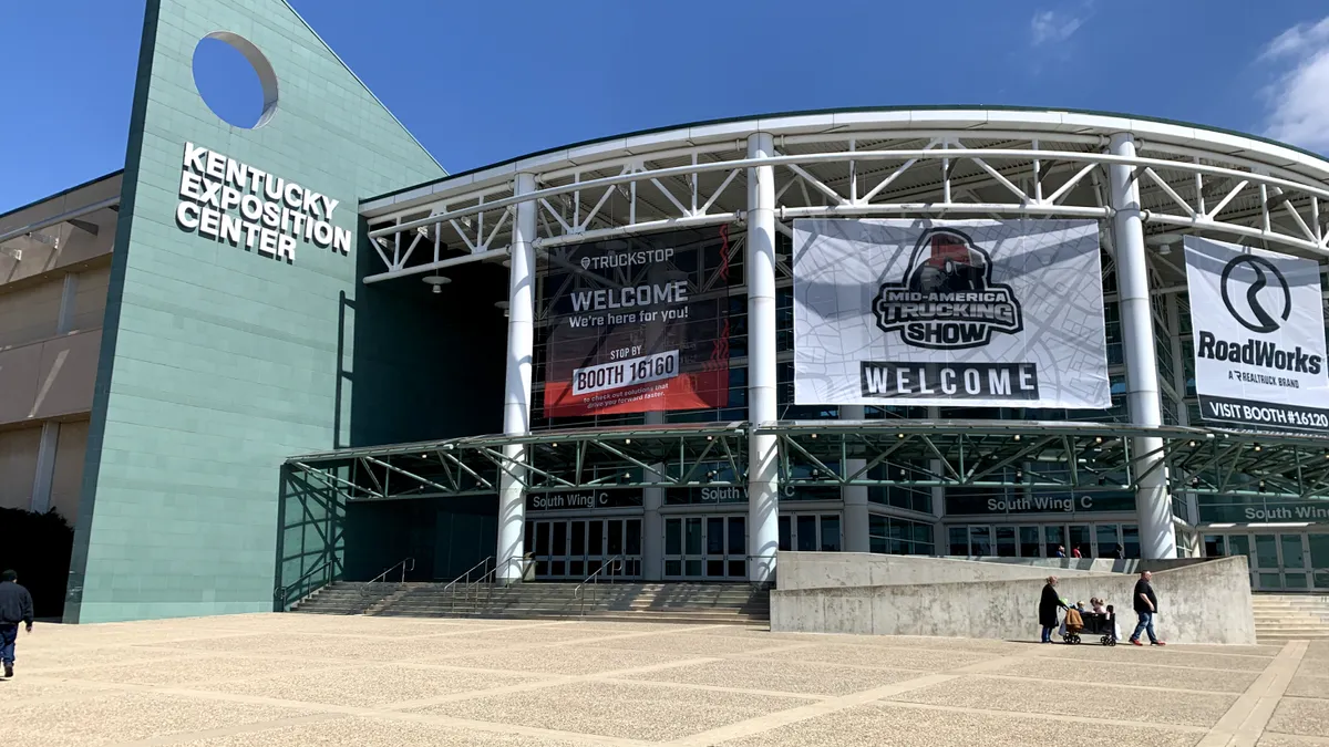 A wing of the Kentucky Exposition Center featuring Mid-America Trucking Show banners for its 2024 event.