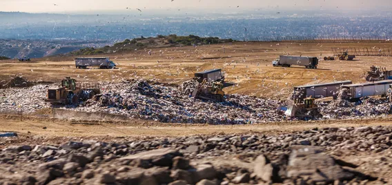 Southern California Landfill with trash, blue sky, seagulls