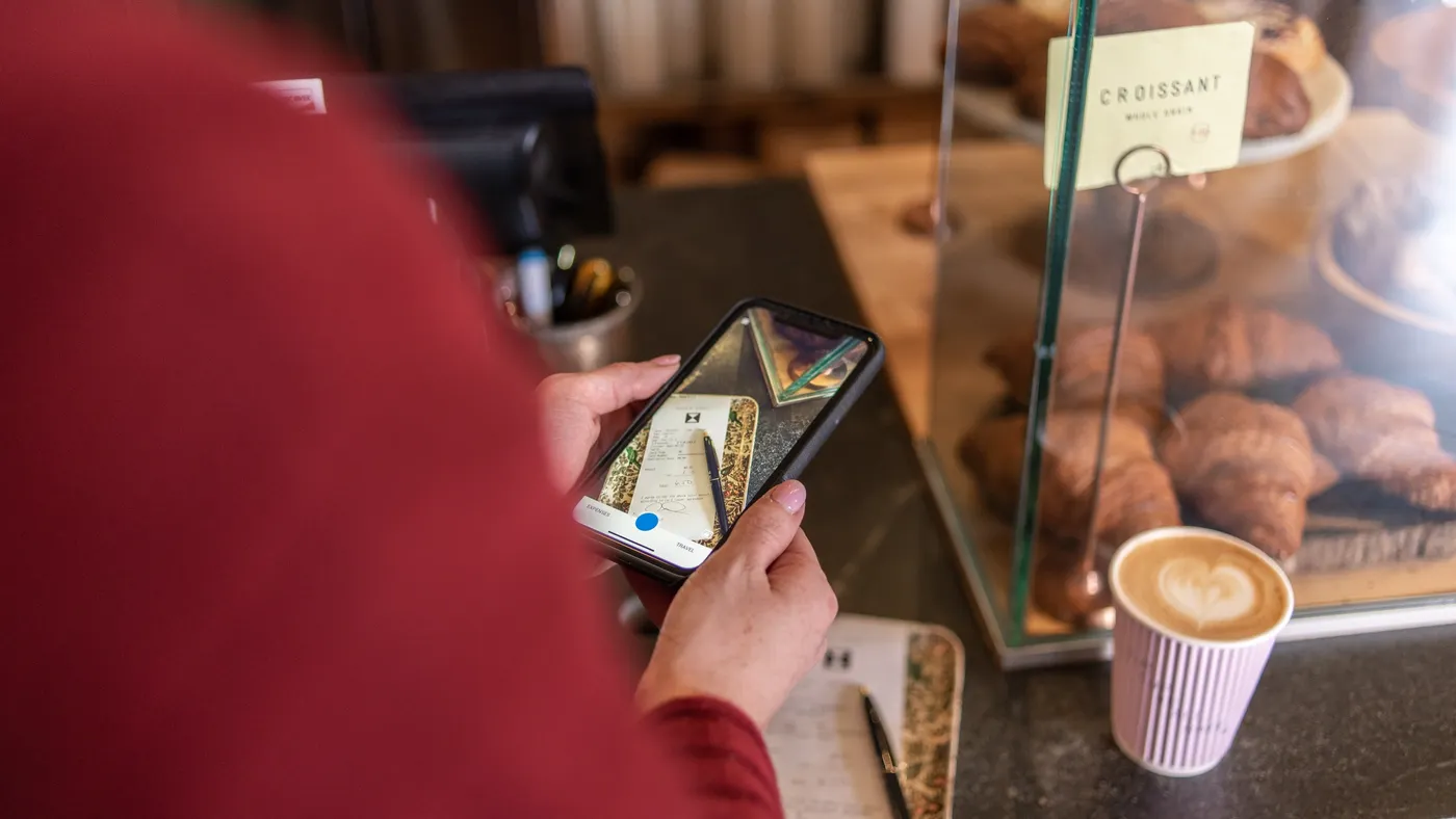 Woman capturing receipt photo