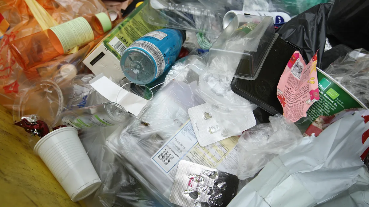 Close-up of plastic packaging in the trash