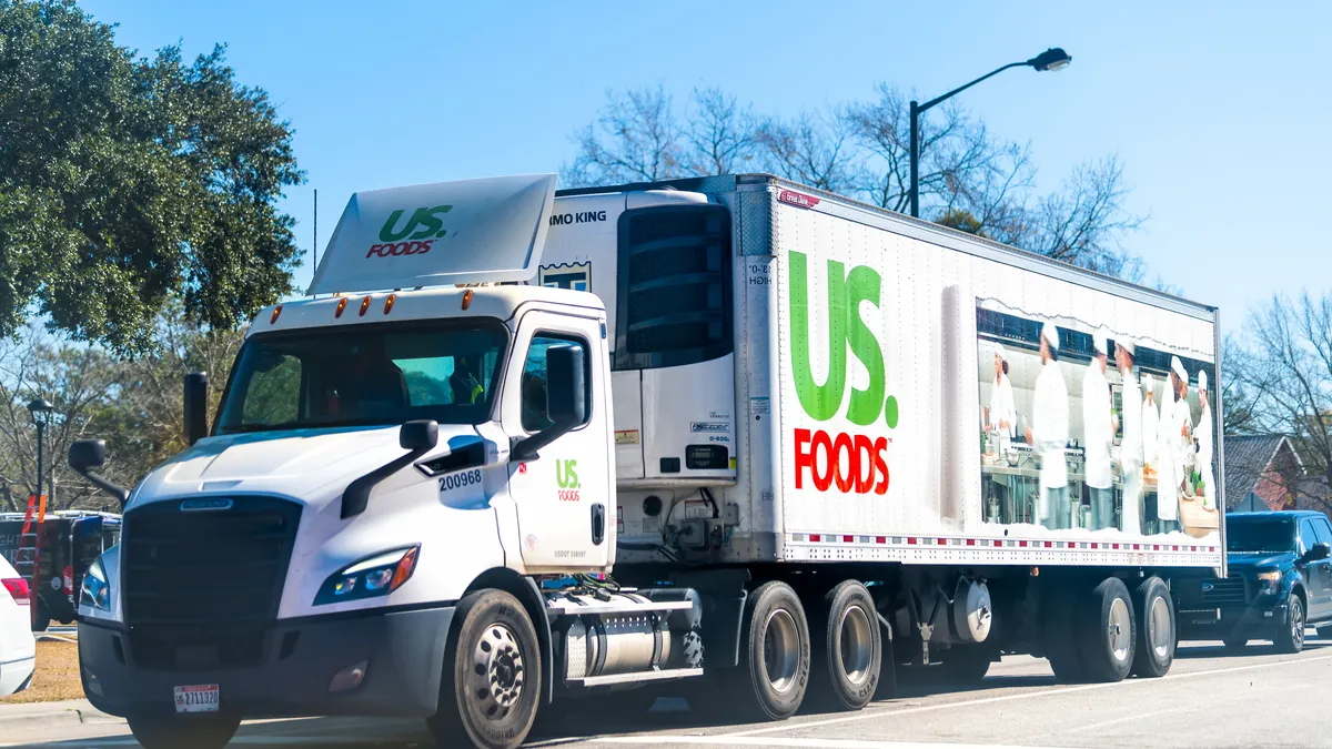 A US Foods tractor-trailer transporting products in South Carolina between passenger vehicles.