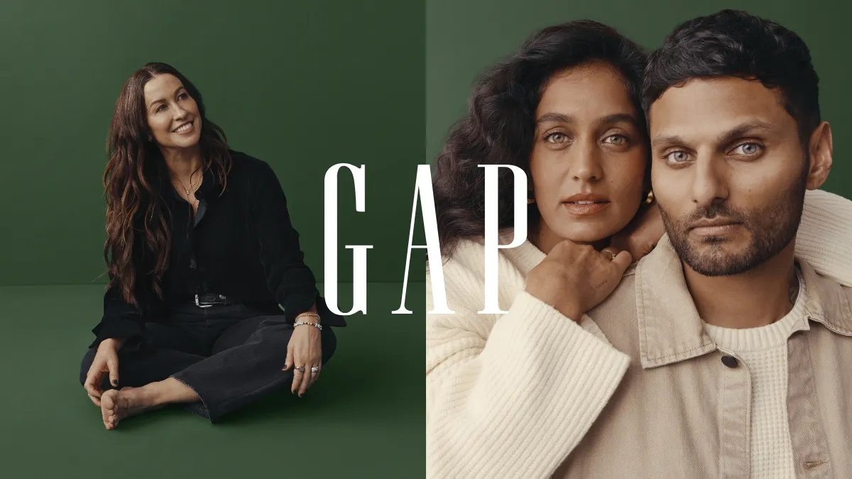 Gap imagery for its 2023 holiday marketing campaign. The image features an individual on the left and a pair on the right styled in Gap looks against a dark green background.