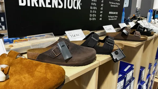 A display of Birkenstock shoes on a shelf inside a DSW store.